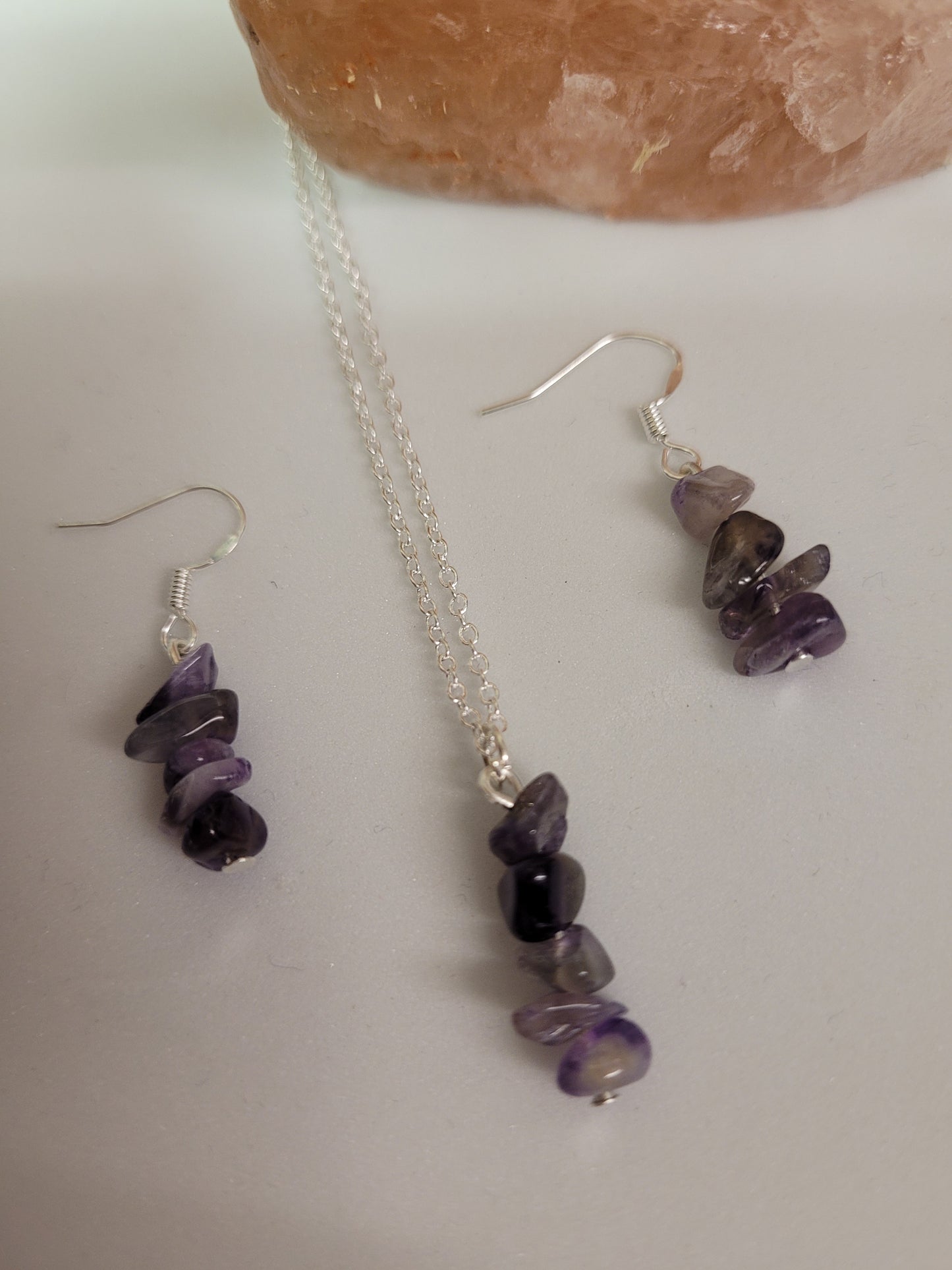 Handcrafted sterling silver plated Amethyst necklace and earring set .