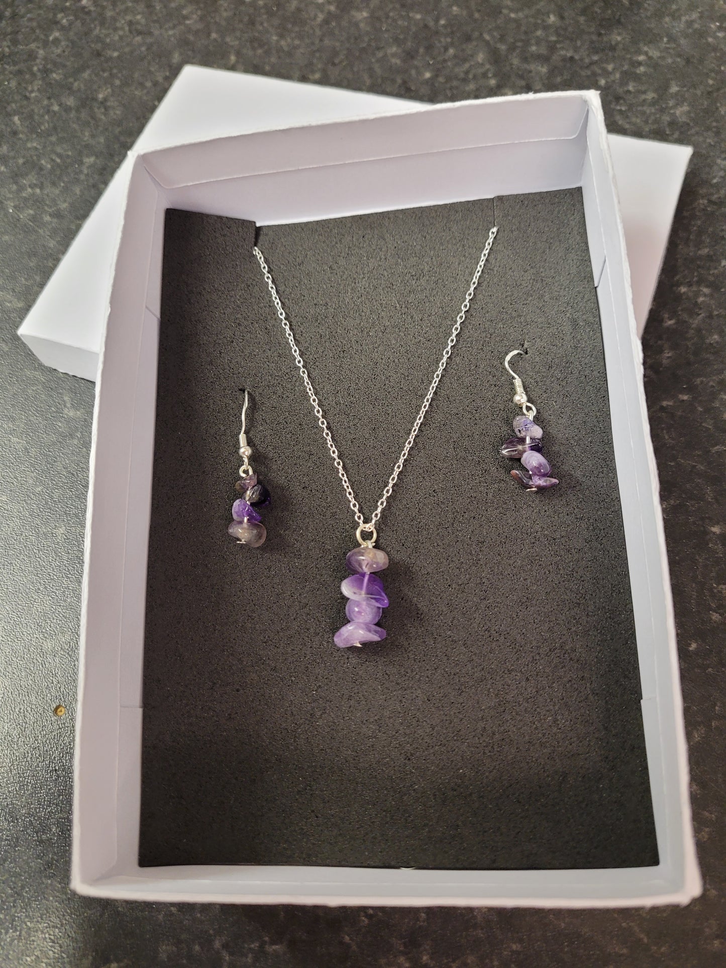 Handcrafted sterling silver plated Amethyst necklace and earring set .